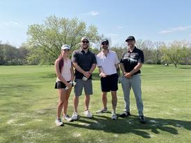 One of the 36 teams competing in the golf tournament.
