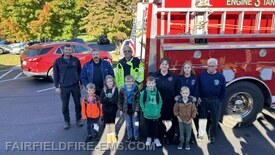 2026 Coloring Contest Winners with members of Fairfield & Fountaindale Fire Departments.